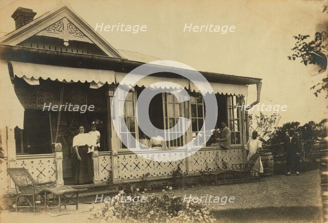 Dacha Seyuza, with the Pray family and servants posed on the front porch..., between 1907 and 1909. Creator: Eleanor Lord Pray.