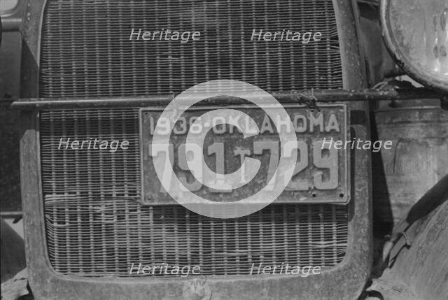 Radiator and license of Oklahoma cotton picker's car, San Joaquin Valley, California, 1936. Creator: Dorothea Lange.