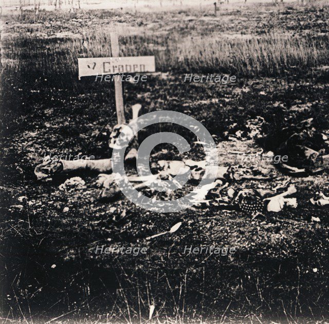 Cross and human remains, c1914-c1918. Artist: Unknown.