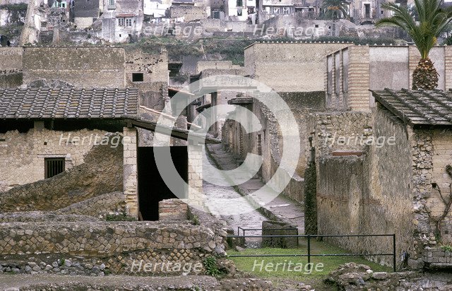 Roman houses of Herculaneum with the modern houses of Ercolano above, Italy. Artist: Unknown