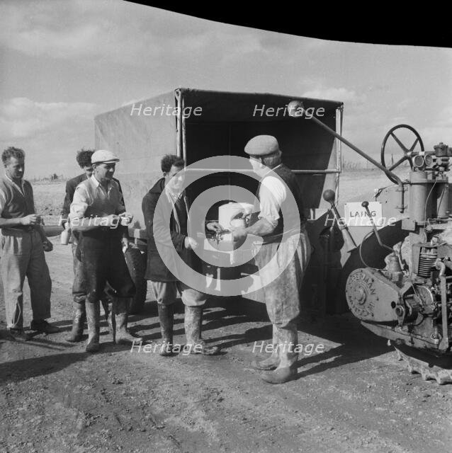 Construction of the M1, the London to Yorkshire Motorway, queuing for the catering van, 09/1958. Creator: John Laing plc.