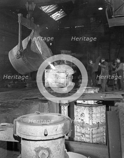 Teeming iron at Wombwell foundry, South Yorkshire, 1963. Artist: Michael Walters