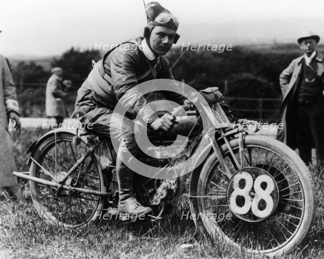 A man dressed in leathers on a Harley-Davidson. Artist: Unknown