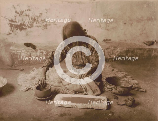 Zuni potter, c1903. Creator: Edward Sheriff Curtis.