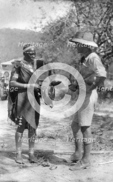 Errol Hinds making a deal in chickens, Wankie to Victoria Falls, Southern Rhodesia, 1925 (1927). Artist: Thomas A Glover