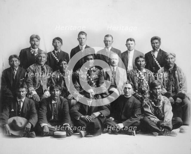 Judge James Wickersham in council with Indian chiefs, between 1900 and 1907. Creator: Unknown.