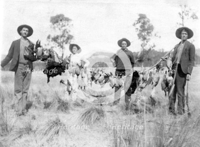 Unknown men and boy with a successful duck shoot, c1900s. Creator: Robert Augustus Henry L'Estrange.