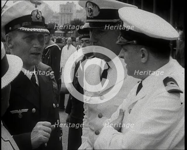 Captain Hans Langsdorff of the German Battleship Graf Spee Talking With Other Naval Officers, 1939. Creator: British Pathe Ltd.