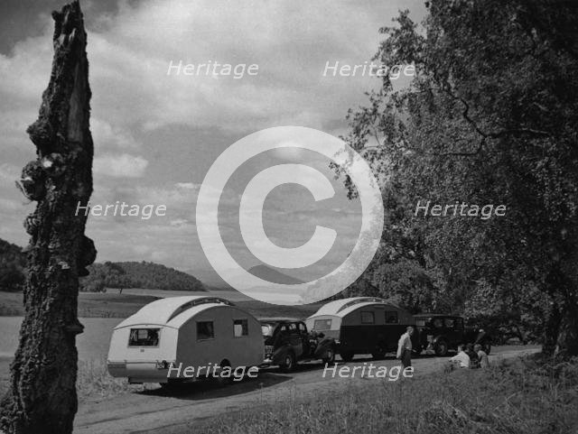 1936 Austin Twenty with caravan and 1936 Oldsmobile Eight with caravan. Creator: Unknown.