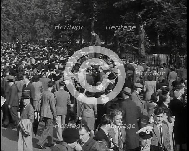 A Crowd of People at Speaker's Corner in Hyde Park, London, Listening to Two Men Speaking..., 1938. Creator: British Pathe Ltd.