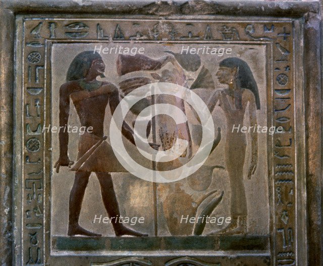 Door shaped stela representing Senouret and his wife in front of their offerings, made in polychr…