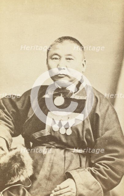 Half-length portrait of man, seated, facing slightly left, between 1870 and 1886. Creator: Unknown.