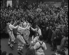 A Crowd of People Watching Morris Dancers Perform, 1931. Creator: British Pathe Ltd.