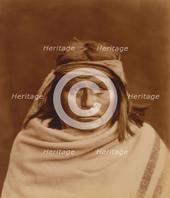 Tah-Lay, Apache? Indian, head-and-shoulders portrait, facing front, wearing blanket and..., c1903. Creator: Edward Sheriff Curtis.
