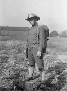 Leonard D.Mahon with Steel Helmet He Invented That Could Be Used As Shovel, 1917. Creator: Harris & Ewing.