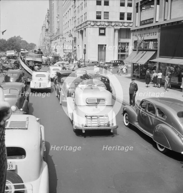 Traffic on Fifth Avenue approaching 57th Street on a summer afternoon, New York City, 1939. Creator: Dorothea Lange.