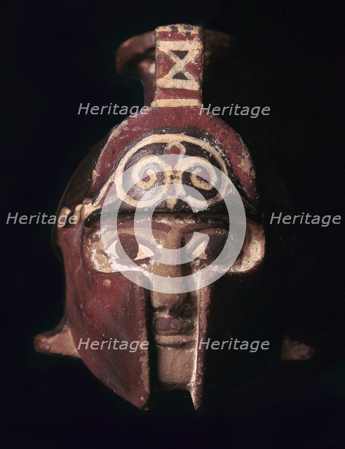 Greek terracotta scent bottle in the shape of a helmeted head, 6th century BC. Artist: Unknown