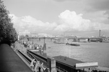 A view of Hungerford Bridge and River Thames, Lambeth, London, c1945-1965. Artist: SW Rawlings