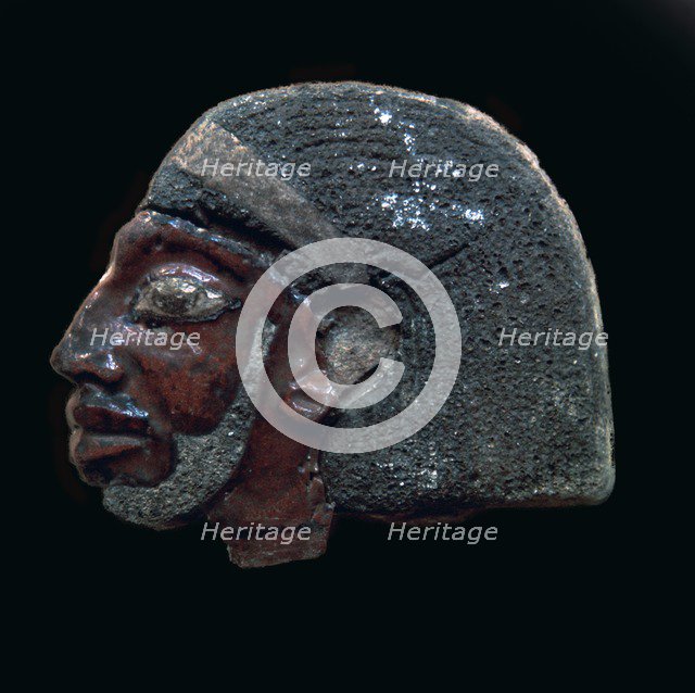 Egyptian glazed relief of a Nubian slave. Artist: Unknown