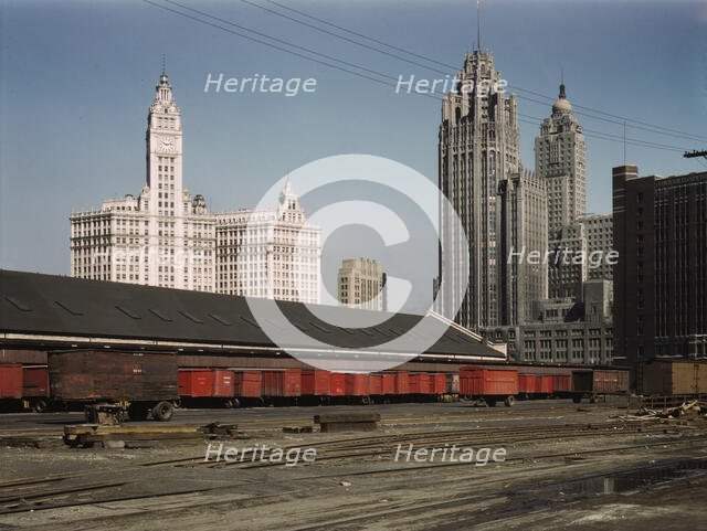 Trucks unloading at the inbound freight house of the Illinois Central Railroad...Chicago, Ill., 1943 Creator: Jack Delano.