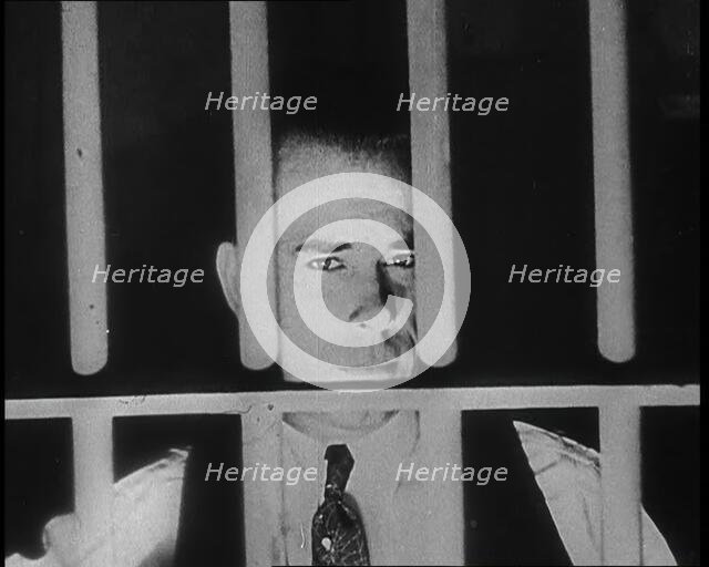 American Gangster John Dillinger Behind Bars, 1930s. Creator: British Pathe Ltd.