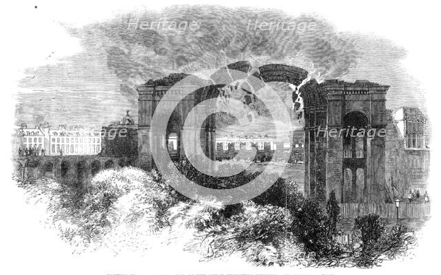 Blowing up the Eastern Arch of the Great Exhibition Building, 1864. Creator: Unknown.