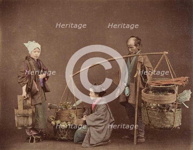 Two Japanese Women and One Japanese Man Posing with Water Bucket and Baskets], 1870s. Creator: Unknown.