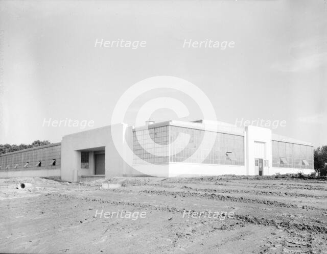View of nearly completed factory for garment workers, Hightstown, New Jersey, 1936. Creator: Dorothea Lange.