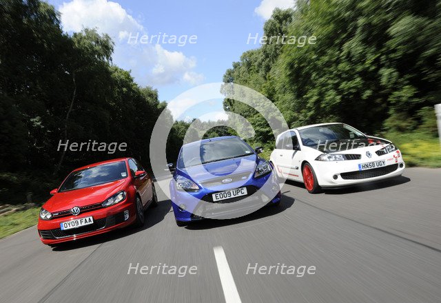 VW Golf GTi Renault Megane Sport R26R and Ford Focus RS 2009. Artist: Simon Clay.