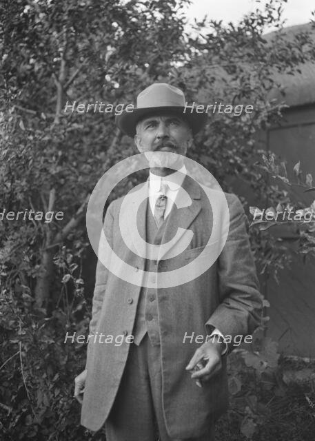 Unidentified man, standing outdoors, between 1896 and 1942. Creator: Arnold Genthe.