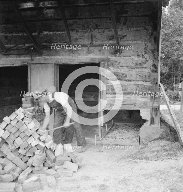 Putting in new flues in tobacco barn, Orange County, North Carolina, 1939. Creator: Dorothea Lange.