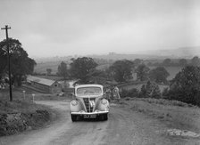 Ford V8 saloon competing in the South Wales Auto Club Welsh Rally, 1937 Artist: Bill Brunell.