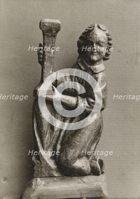 Kneeling figure with a candlestick, (1925-1930).  Creator: Unknown.