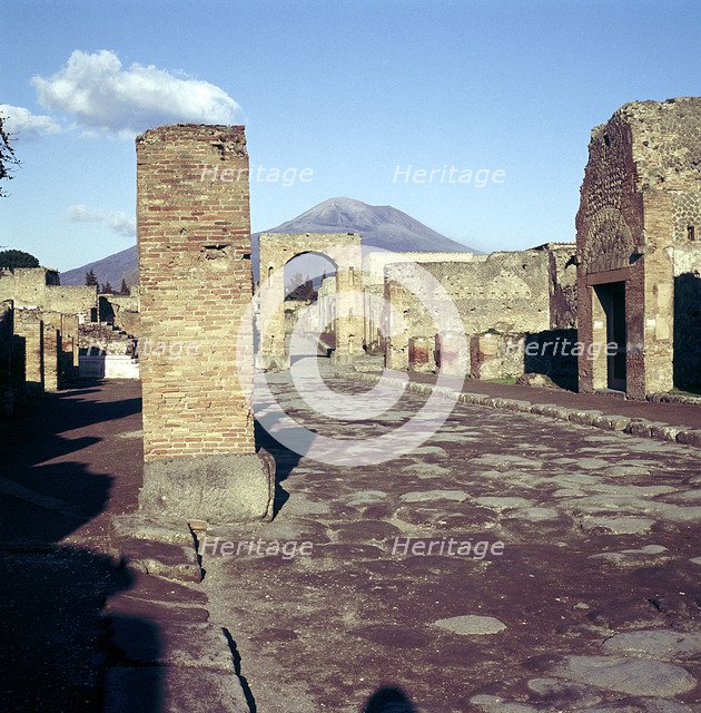 Road leading to Arch of Caligula with Vesuvius beyond, Pompeii, Italy. Creator: Unknown.