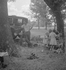 Migrant family from Oklahoma in Texas, alongside the road, 1936. Creator: Dorothea Lange.
