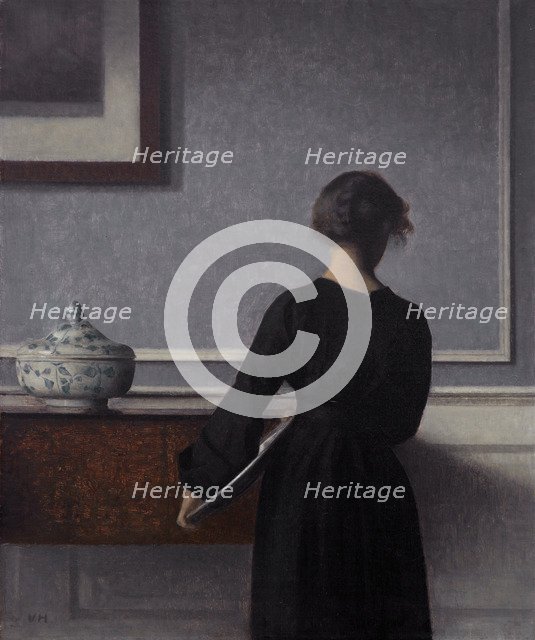 Interior with Young Woman from Behind. Artist: Hammershøi, Vilhelm (1864-1916)