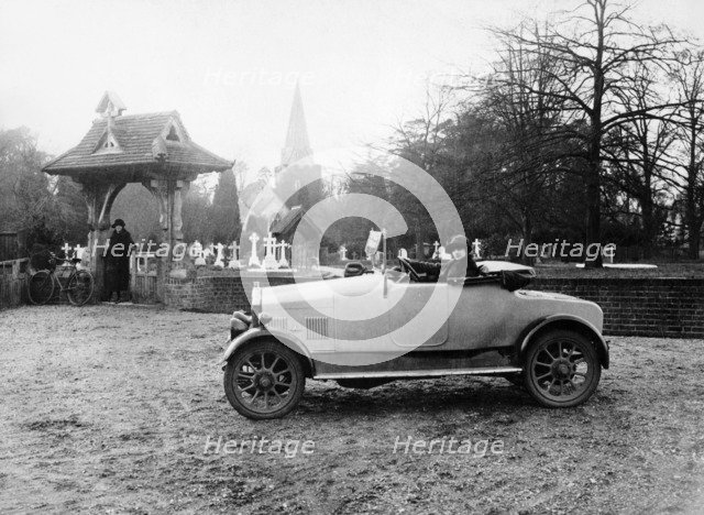 1922 11.9 hp Calcott outside a church, (c1922?). Artist: Unknown