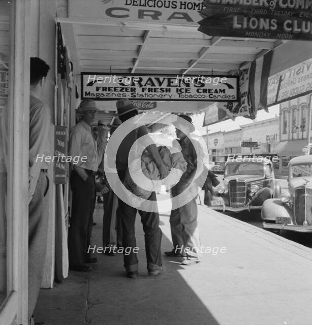 Main street, in front of Oregon Employment Center office, Independence, Polk County, Oregon, 1939. Creator: Dorothea Lange.