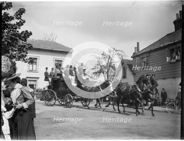 A horse-drawn coach driving past a group of cottages, Greater London Authority, 1895-1905. Creator: Charles William  Prickett.
