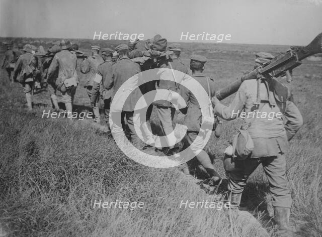 German prisoners with machine guns & wounded, 21 Aug 1918. Creator: Bain News Service.