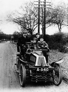 A man and boys in a De Dion car, 1908. Artist: Unknown