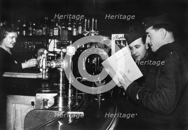 Two French soldiers on leave in a cafe, c1939-1940. Artist: Unknown
