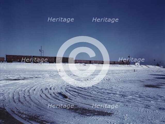 Train going over the hump at C & NW RR's Proviso yard, Chicago, Ill., 1942. Creator: Jack Delano.