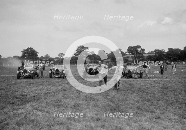 Bugatti Type 43 and 44 and a Bentley taking part in the Bugatti Owners Club gymkhana, 5 July 1931. Artist: Bill Brunell.