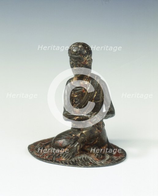 Gilt bronze statue of a lohan seated on a rush mat, late Ming dynasty, China, 1600-1644. Artist: Unknown