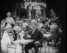 Crowds of People Enjoying Themselves at an Outside Café, 1926. Creator: British Pathe Ltd.