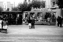 Exhibition of old trams with people in costume in the city center, photo about 1960.