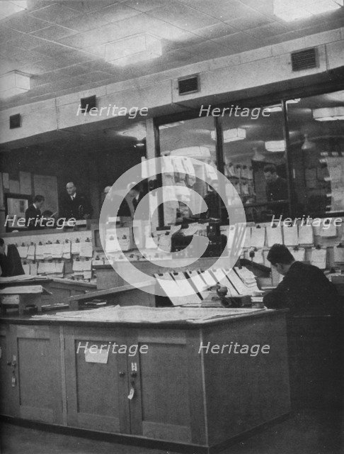 British Naval and Air Force officers working at Area Combined Headquarters, c1940 (1943). Artist: Unknown.