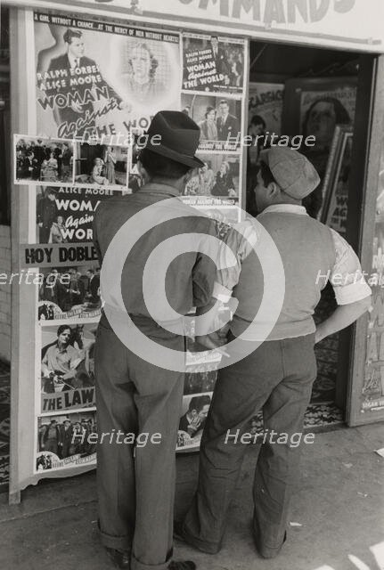 Mexican boys looking at movie poster, San Antonio, Texas,  1939-03. Creator: Russell Lee.