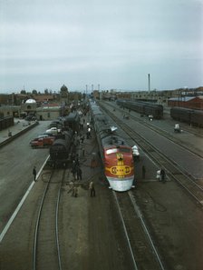 Santa Fe R.R. streamliner, the "super Chief," being serviced..., Albuquerque, N.Mexico , 1943. Creator: Jack Delano.